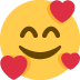 uśmiechnięta buźka z sercami — emotka w stylu X (Twitter), Twemoji